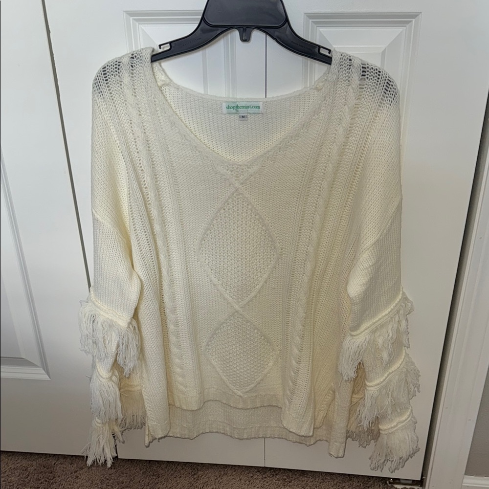 Cream V-Neck Sweater with Cable Knit and Fringe